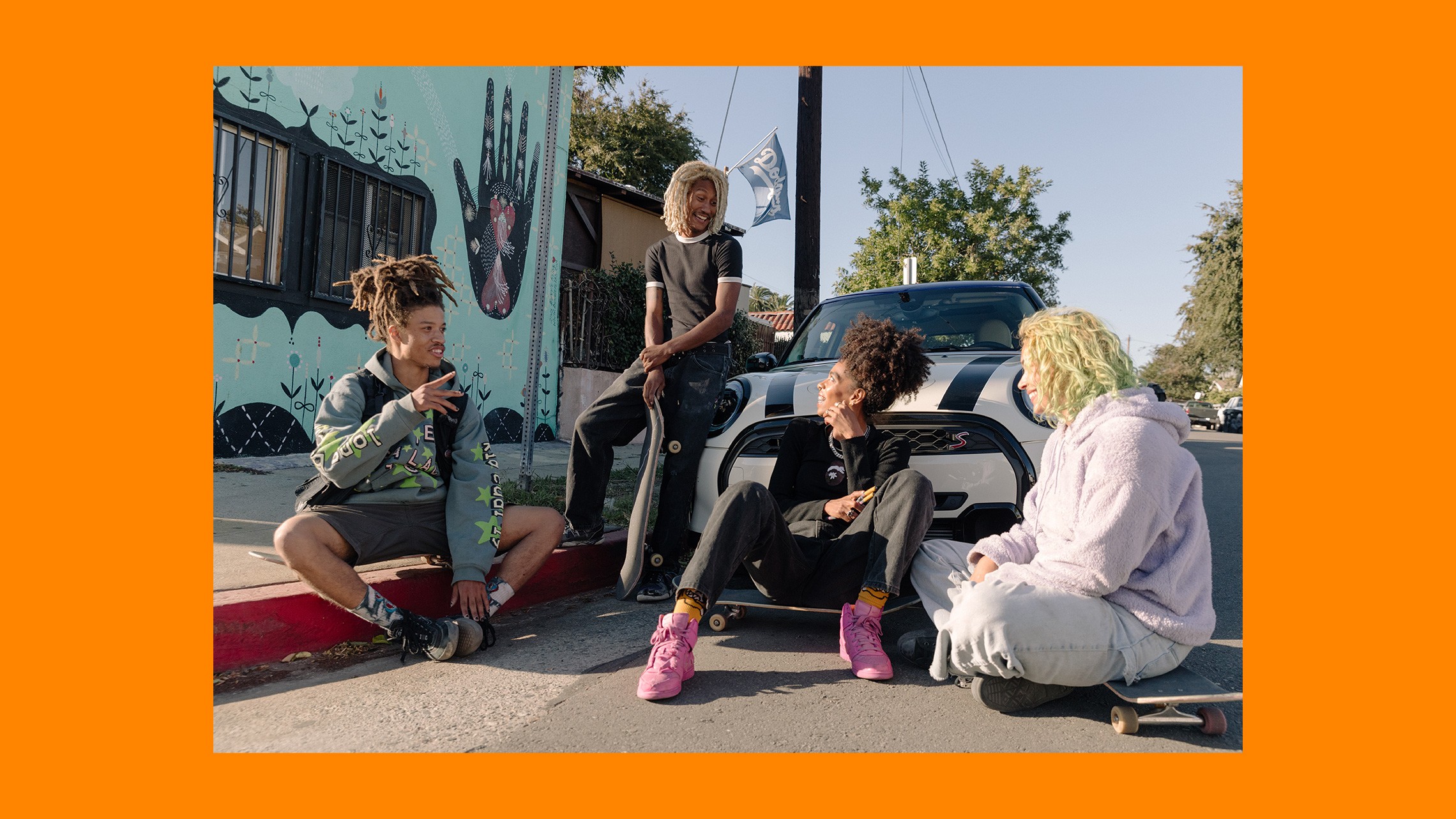 Briana King and her friends relaxing in front of her MINI Cooper S.